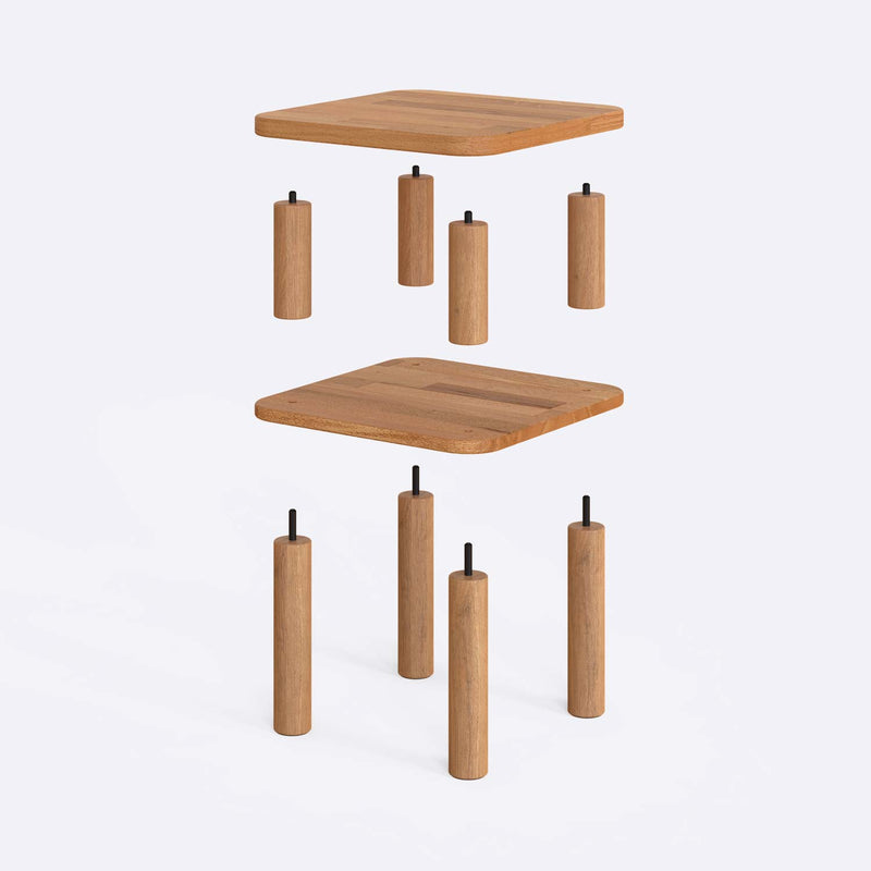 The Manhattan Beech Wood Small End Table placed beside a sofa, demonstrating its functional design