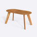 Side view of the Monroe oval wood dining table showcasing its modern design and clean lines.