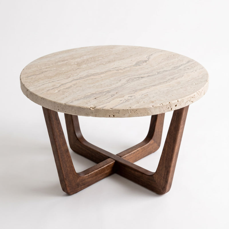 Elevated Studio View of Muse Round Travertine Coffee Table with Walnut Wood Base - Mid-Century Modern Cross Base Design by Tomruque
