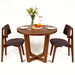 A dining setup featuring the Muse table, styled with tasteful decor and dinnerware