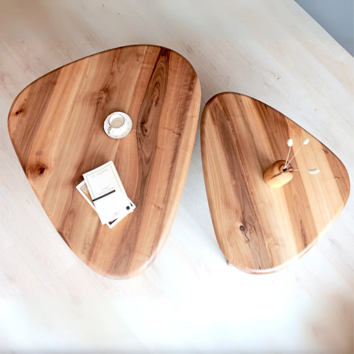 Top-down view of the solid walnut wood coffee table, showing the smooth tabletop.