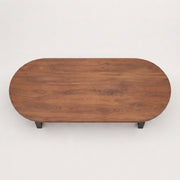 Oasis oval walnut coffee table with a rich walnut wood grain finish and small black metal legs, shown from a top-down perspective