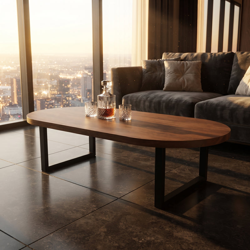 Oasis oval walnut coffee table with black metal legs in a modern living room setting