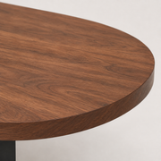 Modern oval walnut coffee table with softly rounded edges