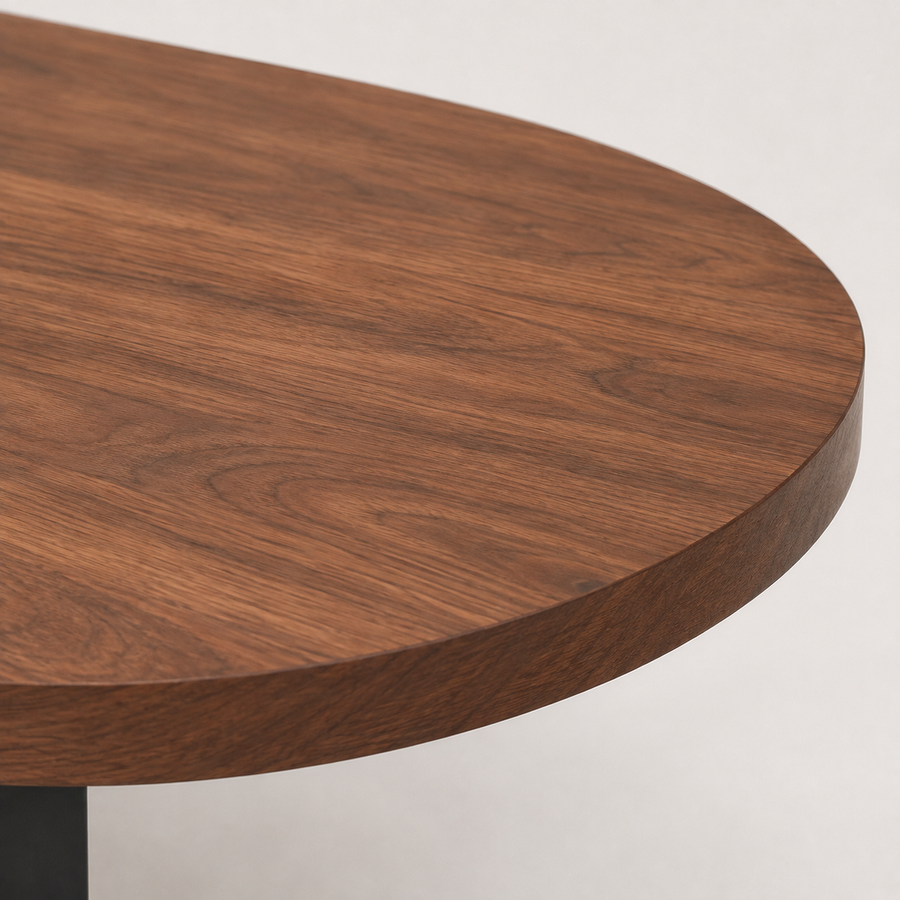 Modern oval walnut coffee table with softly rounded edges