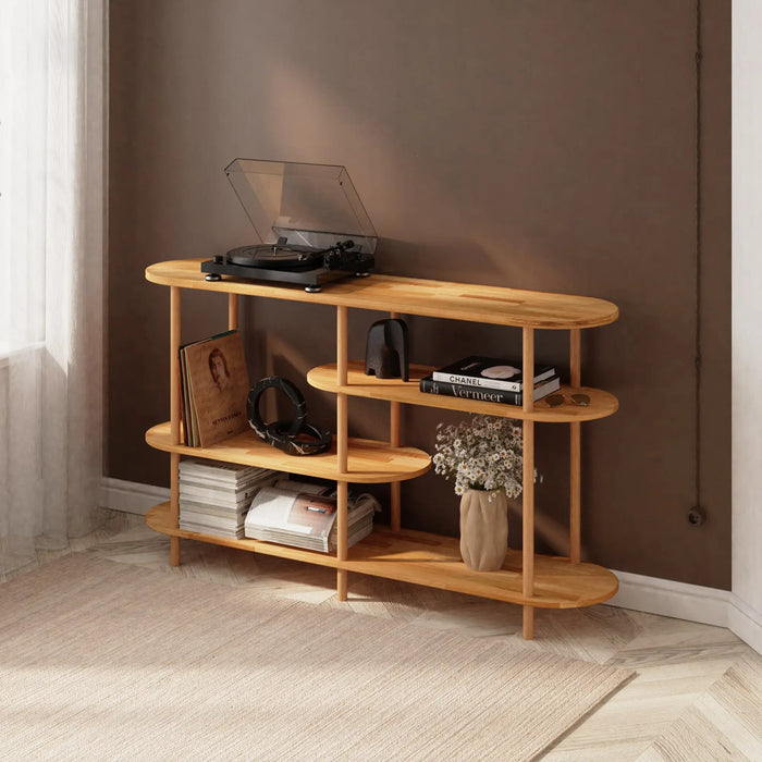 The Oslo bookcase placed in a cozy living room, styled with books, plants, and decorative accents.