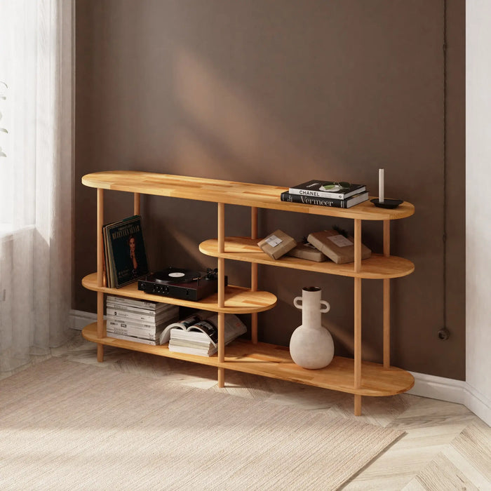 The Oslo shallow bookcase in a workspace, neatly organizing office supplies, books, and small decor items.