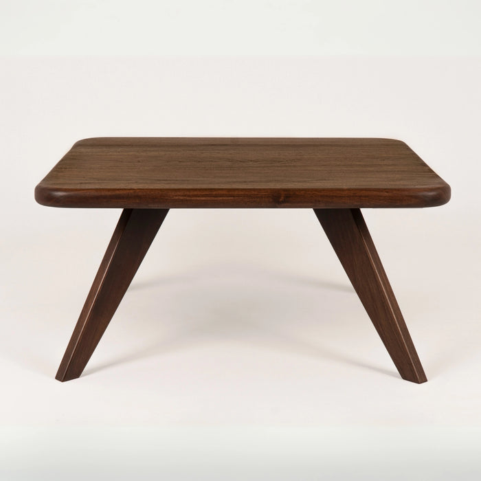 Solid wood coffee table with a white background