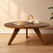 Petra Wood Round Coffee Table, mid century modern designed legs and tabletop, with a warm background