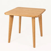 Petra Square Wood Dining Table Solid Oak Wood with rounded corners and tapered legs, shown on a clean white background.