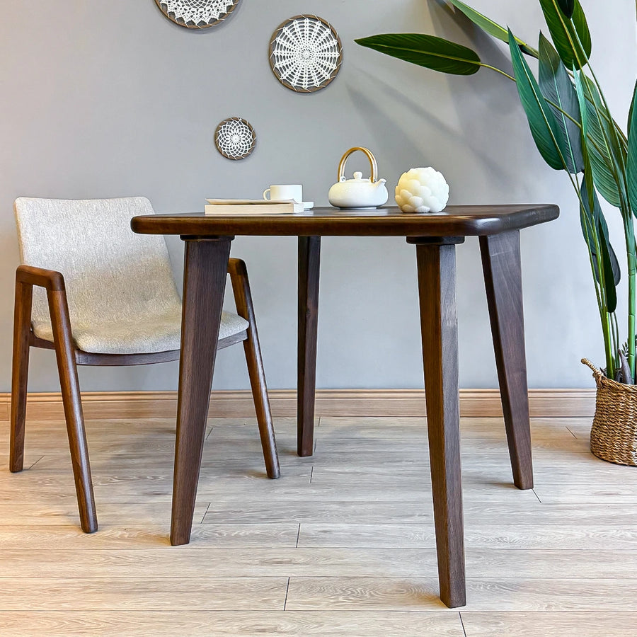 Side view of the table displaying its clean lines and sturdy construction, ideal for contemporary dining rooms.