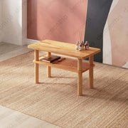 Modern wood coffee table with a minimalist design, featuring clean lines and a natural wood finish.