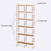 Stylish bookcase adorned with books, plants, and decorative items in a bright, modern living room.