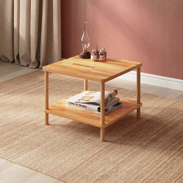 Solid wood coffee table with a storage shelf small size from a diagonal angle in a light colored hall setting.