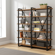 Renton Industrial Bookcase | Solid Wood Wide Shelves with a black metal frame and warm brown wooden shelves, styled with books, vases, and plants in a bright room with a window and light wood floor.