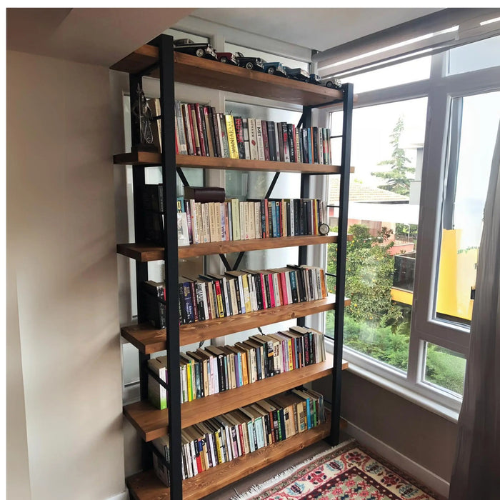 Detailed view of the top shelf, featuring the natural finish and smooth surface of the rustic bookshelf.