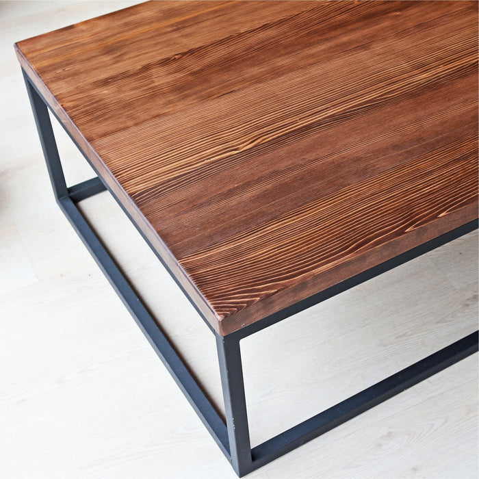 Top-down view of the Renton square wooden coffee table from the other side, showcasing the smooth surface and wood grains without decor.