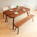 Front view of a dining table solid wood with a minimalist design and natural wood grain.