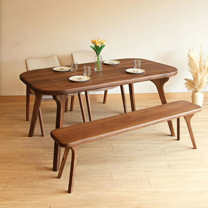 Close-up of the table’s solid wood legs crafted with precision and showcasing unique design elements.