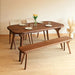 Close-up of the table’s solid wood legs crafted with precision and showcasing unique design elements.