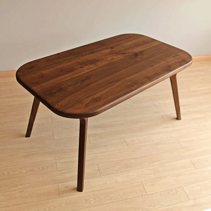Family dining scene with an authentic wood table beautifully set for an evening meal.