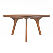 Sidney Round Coffee Table - Solid Walnut Wood - Mid Century Modern Designwith a rounded oval top and three sculptural curved legs, shown on a solid white background.