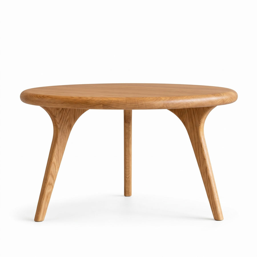 Sidney Solid Oak Wood Round Coffee Tablewith a natural oak finish, featuring a thick round tabletop and three curved, tapered legs, shown on a solid white background.