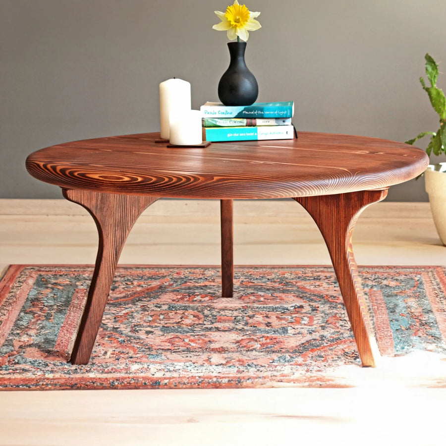 Close-up view of a Solid Pine Wood Mid Century Round Coffee Table showcasing smooth wood grain and sleek design.