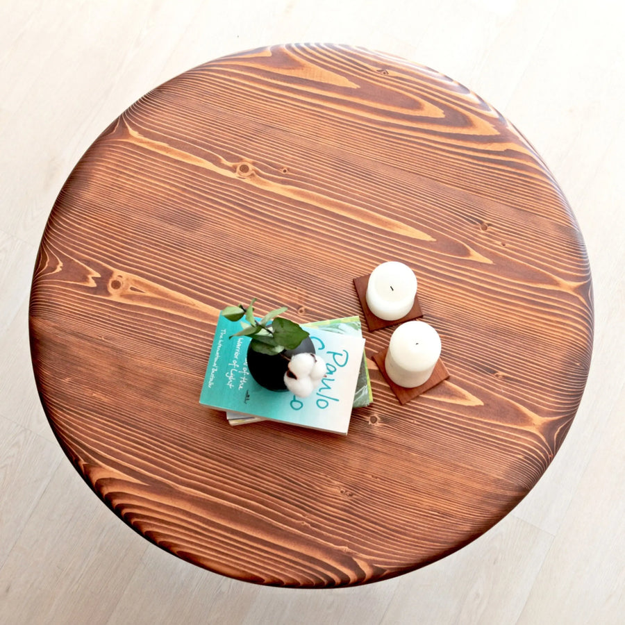 Close-up shot of the table’s natural wood finish, showing intricate grain patterns and polished surface.
