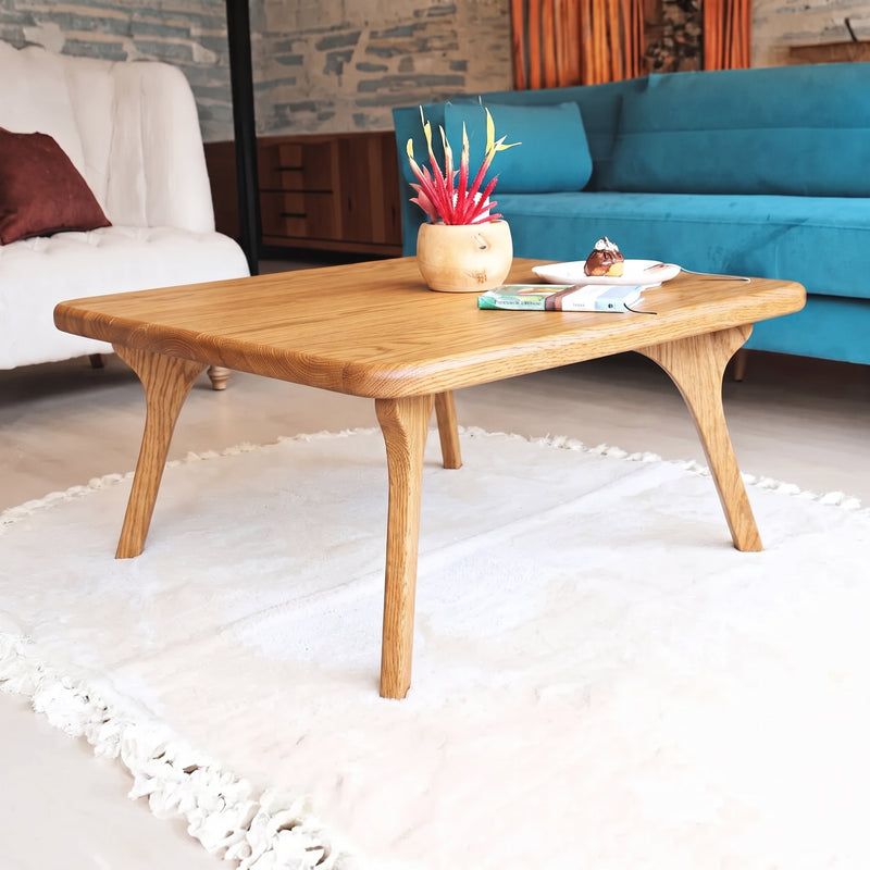 Sidney Square Wood Coffee Table Solid Oak Wood – Mid-Century Modern Design with tapered legs, styled in a modern living room setting on a white fringed rug.