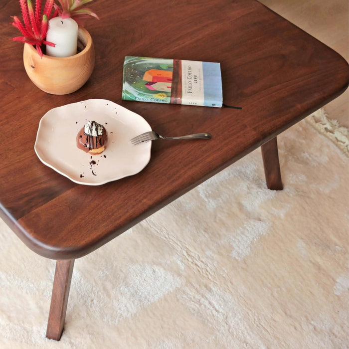 Close-up view of the tabletop of the Sidney Square Coffee Table, highlighting the natural wood grain and smooth finish that enhances its modern aesthetic.