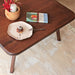 Close-up view of the tabletop of the Sidney Square Coffee Table, highlighting the natural wood grain and smooth finish that enhances its modern aesthetic.