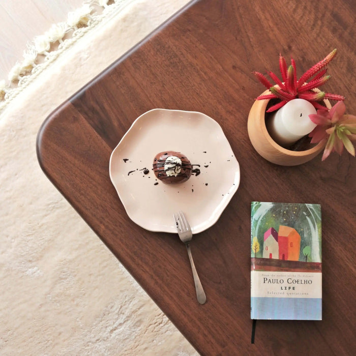 Another close-up view of the Sidney Square Coffee Table’s surface, showcasing its rich walnut color and fine details in the wood grain.