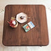 Top view of the Sidney Square Coffee Table, featuring a spacious tabletop design made from solid walnut wood, perfect for displaying decor and everyday use.