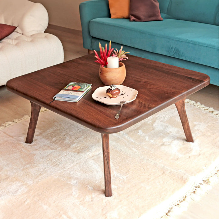 Top diagonal angle of the Sidney Square Coffee Table, capturing the elegant design and smooth surface while showcasing the distinctive legs that define its mid-century modern style.