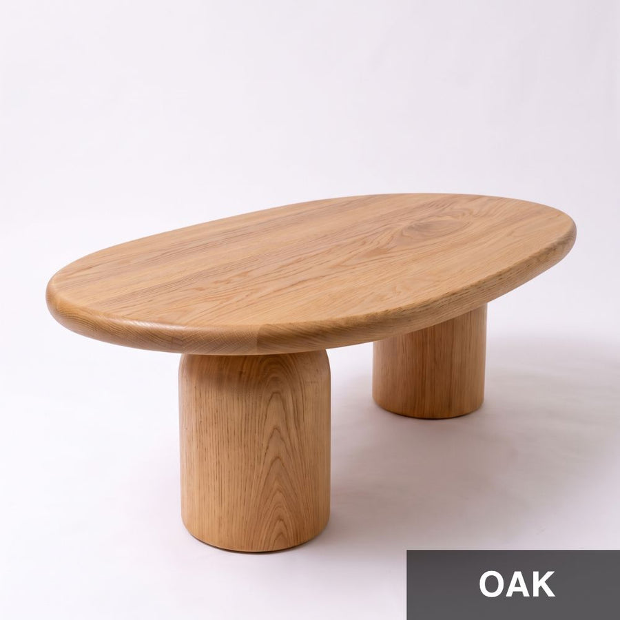 High-angle view of the Solen Oval Solid Wood Coffee Table – Oak & Walnut Sculptural Double Pedestal Design in a natural oak finish.
