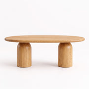 Front view of the Solen Oval Solid Wood Coffee Table – Oak & Walnut Sculptural Double Pedestal Design
