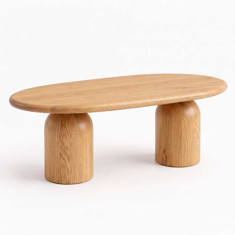 Three-quarter view of the Solen Oval Solid Wood Coffee Table – Oak & Walnut Sculptural Double Pedestal Design in a natural oak finish.