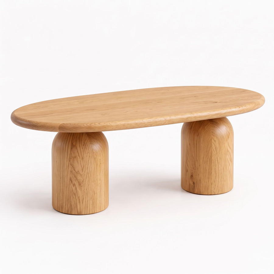 Three-quarter view of the Solen Oval Solid Wood Coffee Table – Oak & Walnut Sculptural Double Pedestal Design in a natural oak finish.