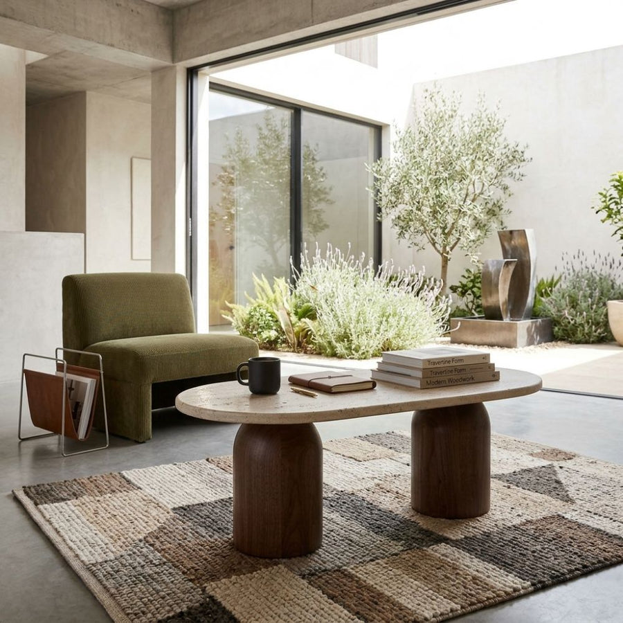Solen Oval Travertine Coffee Table with Walnut Wood Base - Sculptural Organic Modern Design Styled in a Modern Courtyard Living Space by Tomruque