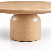 Close-Up of Sculptural Cylindrical Pedestal Base on Solen Round Solid Oak Coffee Table in Natural Oak Finish by Tomruque