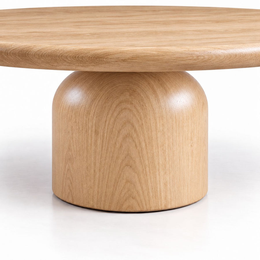 Close-Up of Sculptural Cylindrical Pedestal Base on Solen Round Solid Oak Coffee Table in Natural Oak Finish by Tomruque
