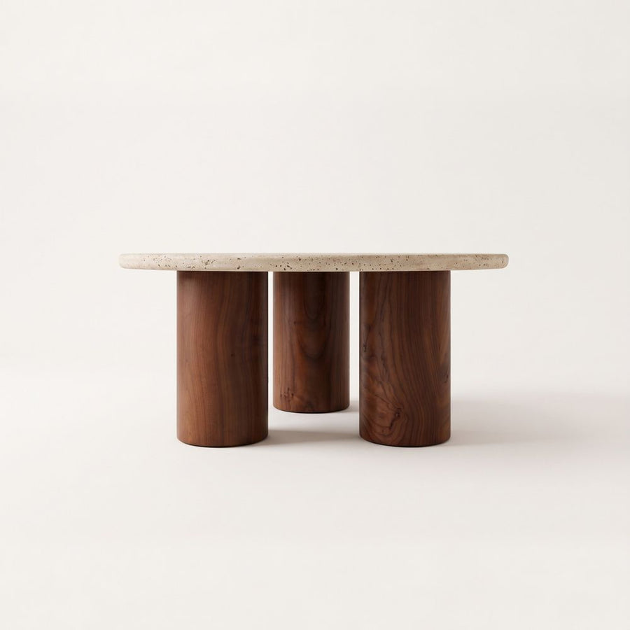 Terra Round Travertine Coffee Table with Walnut Wood Triple Pedestal Base - Sculptural Modern Design Straight-On Studio View by Tomruque