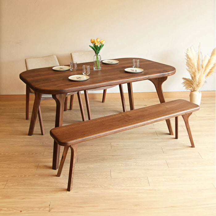 Close-up of the Toledo dining table's metal legs, emphasizing the clean, industrial design.