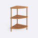 Side view of Webb Wood Corner Bookcase with three spacious shelves, placed in a modern living room corner