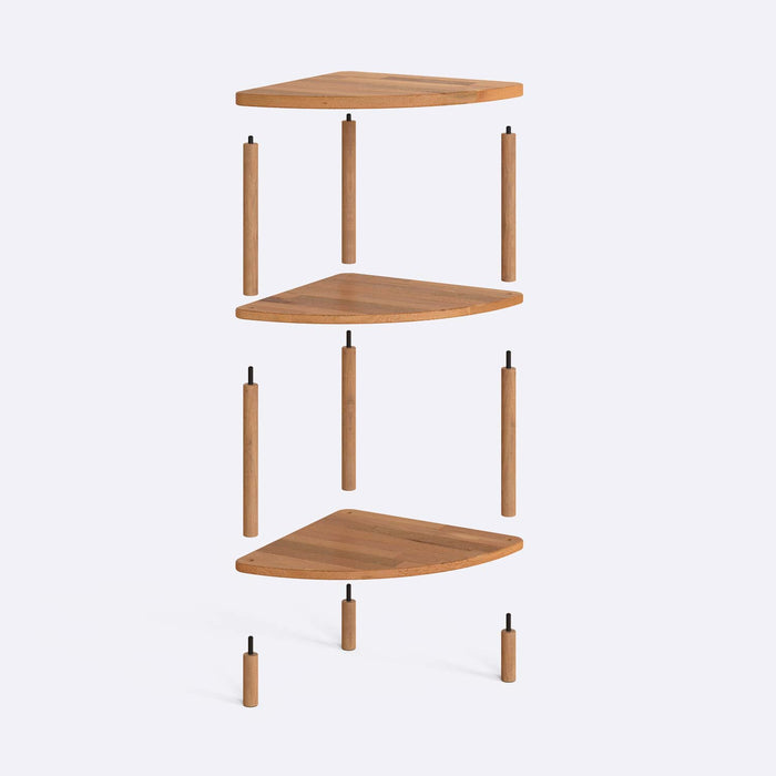 Close-up of the corner of Webb Wood Corner Bookcase, highlighting the smooth finish and natural wood tones.