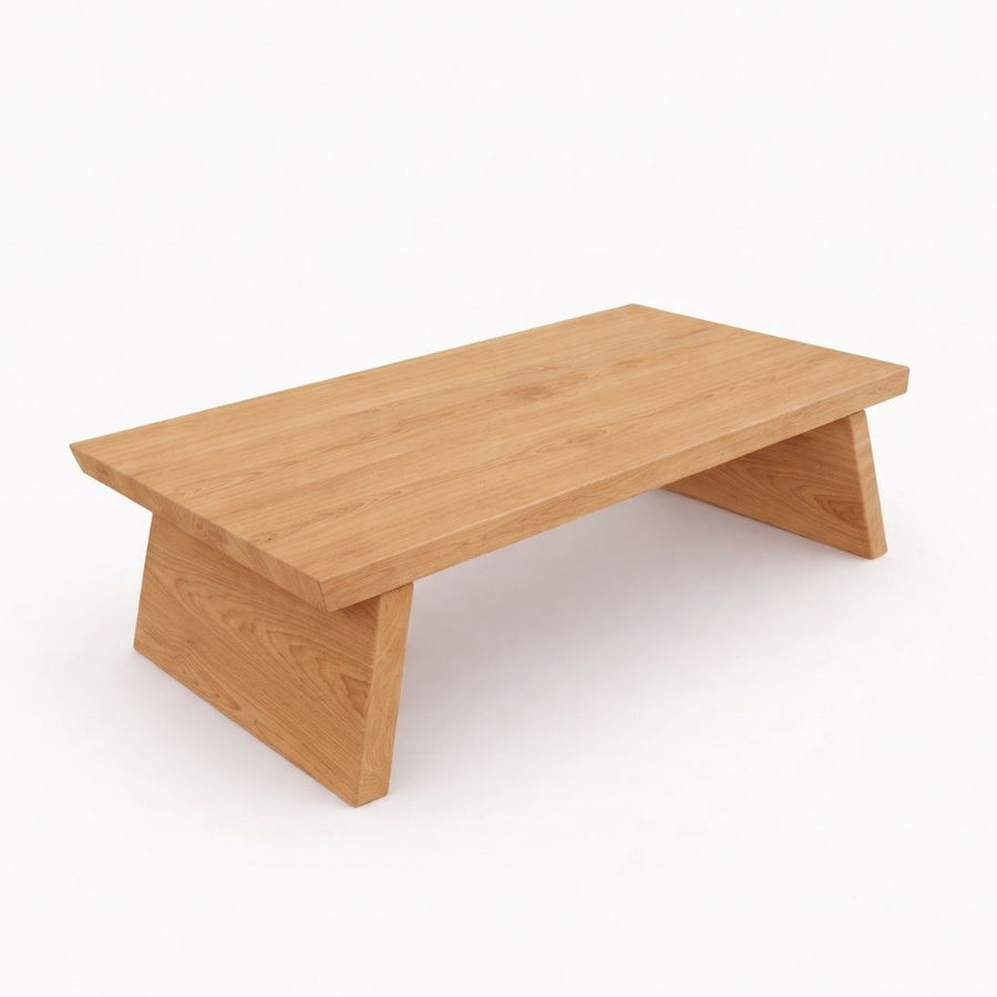 Yoro Solid Oak Wood Coffee Table with a natural oak finish, featuring a thick top and angled support legs, shown on a plain white background.