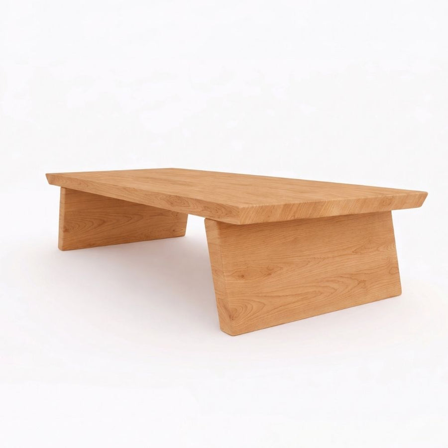 Yoro Solid Oak Wood Coffee Table with a natural oak finish, featuring a thick rectangular tabletop and angled block-style legs, shown on a seamless white background.