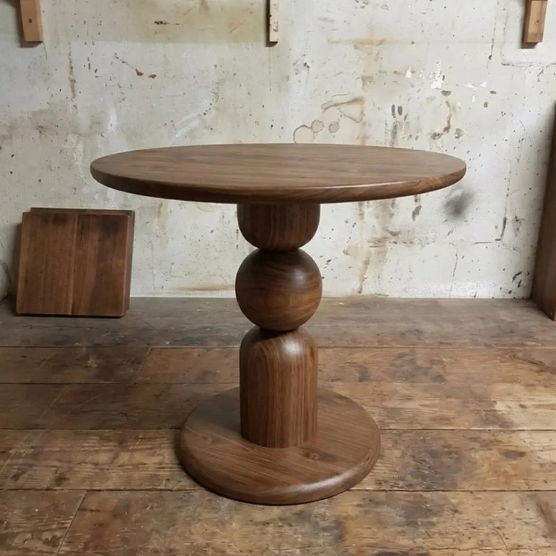 Dorel Round Walnut Dining Table with Sculptural Base – Modern Pedestal Design