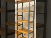  A 360-degree video of the Portland Pine Room Divider Bookcase, highlighting its solid pine wood construction, metal legs, and how it functions as a stylish room divider and organizer.
